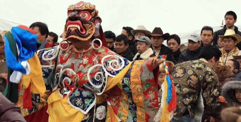 Buddhist monks performing dance Phutak Festival in Olangchung Glola